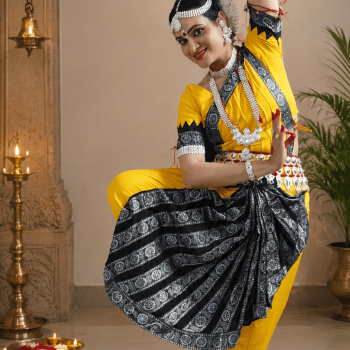 Graceful Odissi dance in elegant temple setting